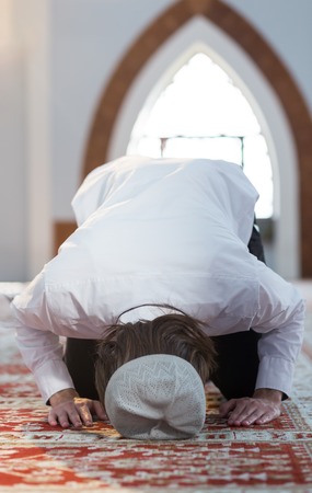 Religious muslim man praying, steps of prayingの写真素材