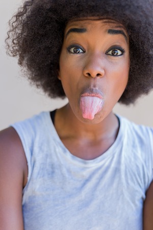 Beautiful afro american women doing funny posesの写真素材