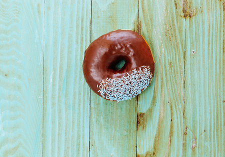 fresh donut on wooden table topの写真素材