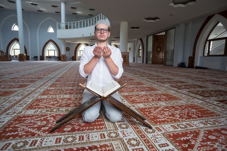 Young muslim man is praying in the mosqueのeditorial素材