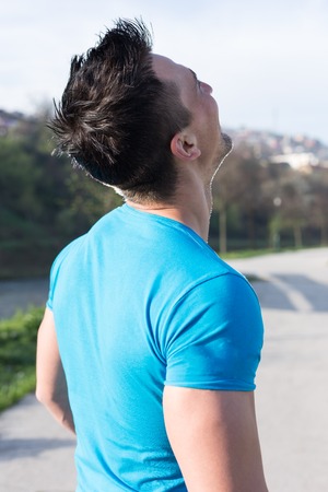 Portrait Of Young Man Doing Outdoor Activity Runningの写真素材