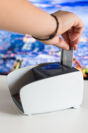 Moment of payment with a credit card through terminalの写真素材