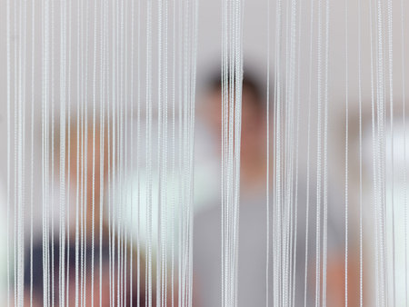 People blurred. Line curtain in focus