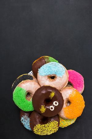 Top view, flat lay, donuts on chaalkboardの写真素材