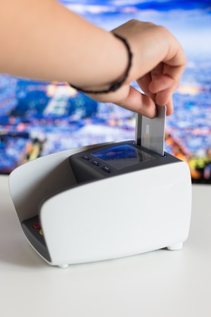 Moment of payment with a credit card through terminalの写真素材