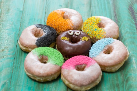 Chocolate glazed donuts and sprinkle donuts.の写真素材