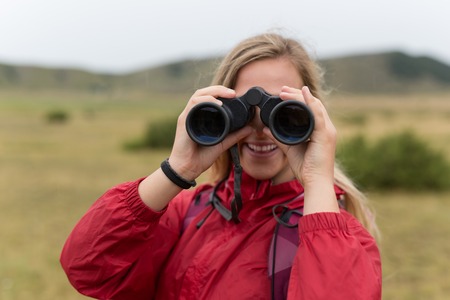 woman tourist on a background of mountainsの写真素材