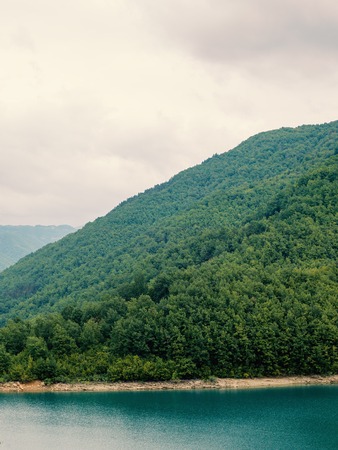 Mountain lake between by mountainsの写真素材
