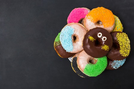 Top view, flat lay, donuts on chaalkboardの写真素材