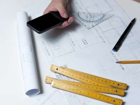 Business man draw buildings and present his architectural projectの写真素材