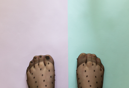Selfie of woman bare feet on  pastel backgroundの写真素材