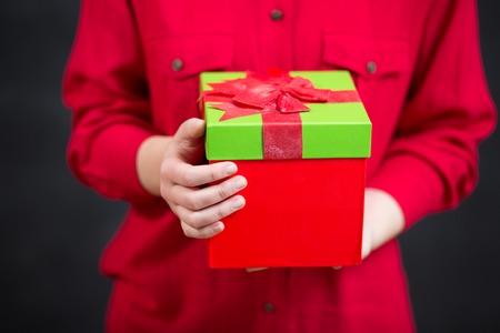 Close-up of female hands holding a presentの写真素材