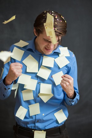 Businessman throwing confetti in the airの写真素材