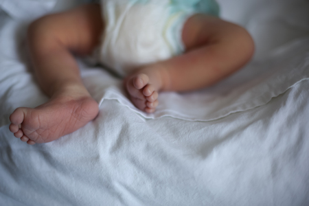 little baby feet, close up on whiteの写真素材