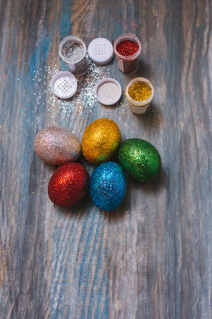 Easter eggs on wooden table. Holiday backgroundの写真素材