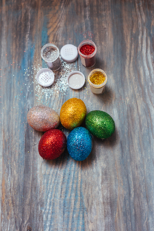 Easter eggs on wooden table. Holiday backgroundの写真素材