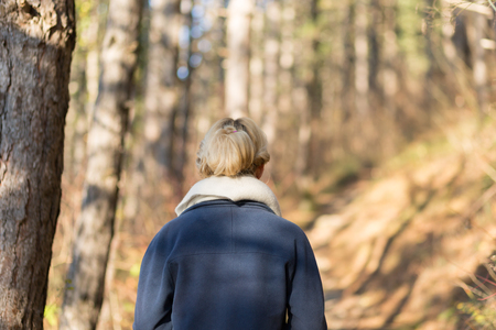 Portrait of young beautiful woman in autumn pullover. Blonde girl with scarf - flareの写真素材