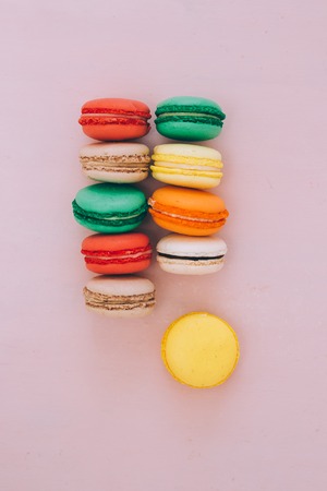traditional french colorful macarons in a rowsの写真素材