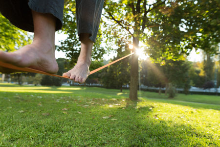 Slackline. Close up of foots on the rope