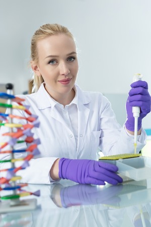 Young pretty girl in the modern laboratoryの写真素材