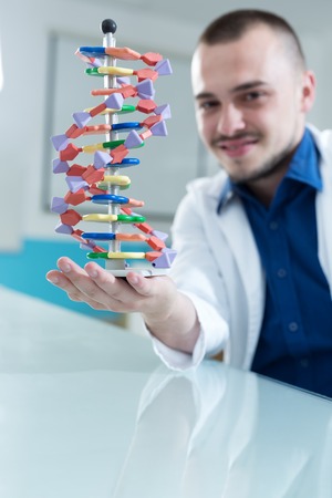 New technologies in medicine. Scientist and molecule of DNAの写真素材