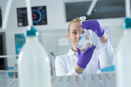 laboratory assistant analyzing a sampleの写真素材