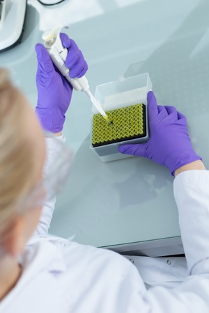 Young pretty girl in the modern laboratoryの写真素材