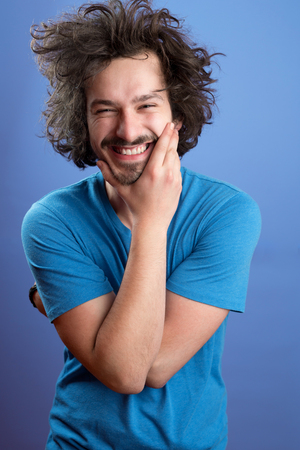 Beautiful afro man in front of a colored backgroundの写真素材