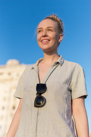 Young girl in a bikini posing near the shoreline, summerの写真素材