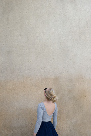 Portrait of a woman against the blank wall. Copy space for your text.の写真素材