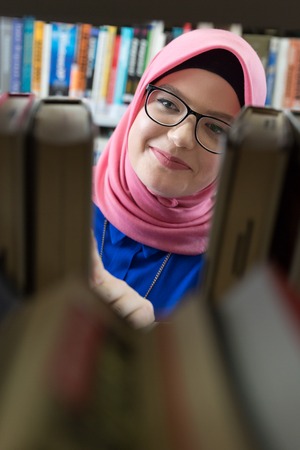 Portrait of Muslim student in the libraryの写真素材