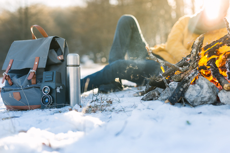 Camping concept. Bonfire on a winter day in a wood.の写真素材