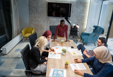 Multi-Cultural Office Staff Sitting Having Meeting Togetherの写真素材