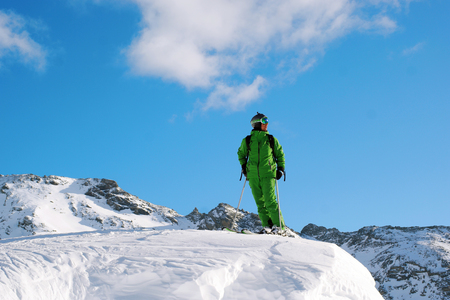 male is skiing in fresh powderの写真素材