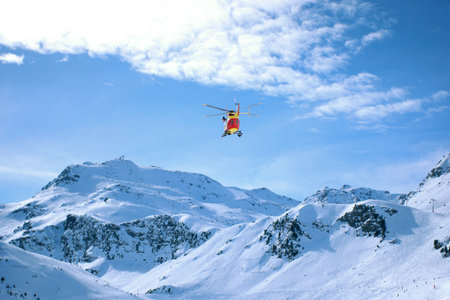Helicopter in mountains - France Alps - nature and transportation background