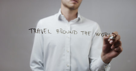 Travel around the world , Man Writing on Glass