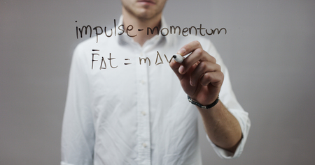 Impuls-momentum formula , Man Writing on Glassの写真素材