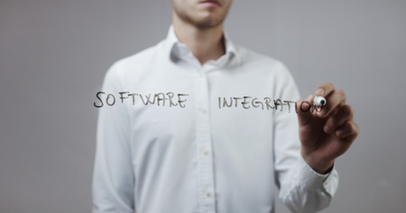 Software integration , Man Writing on Glassの写真素材