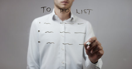 To do list , Man Writing on Glass