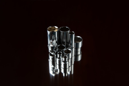 Flare nut wrench set on a reflecting surfaceの写真素材