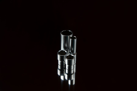 Flare nut wrench set on a reflecting surfaceの写真素材