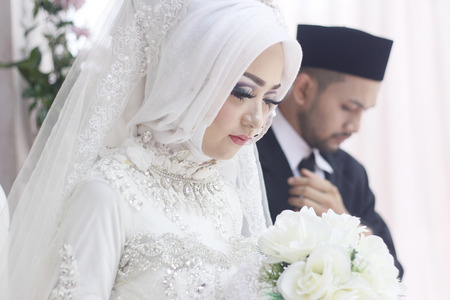 Cute & Romantic Muslim Couples at a celebration ceremonyの写真素材
