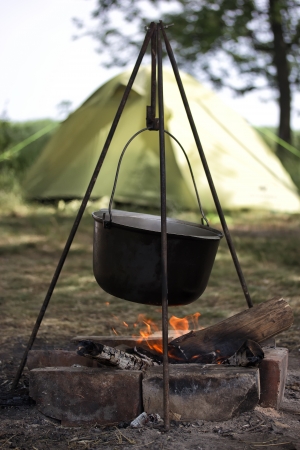 pot on a fire against the tentの写真素材