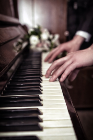 Hand playing music on the piano, hand and piano playerの写真素材