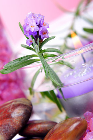 Elements of lavender SPA: fresh lavender, lavender candle. lavender salt and polished stones.の写真素材