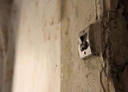 Light swith in abandoned room.の写真素材