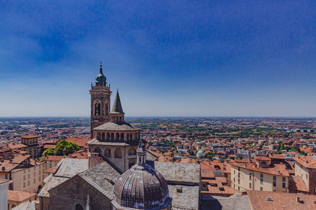 View of the Basilica of Santa Maria Maggiore and the lower city of Bergamo, Italyの写真素材