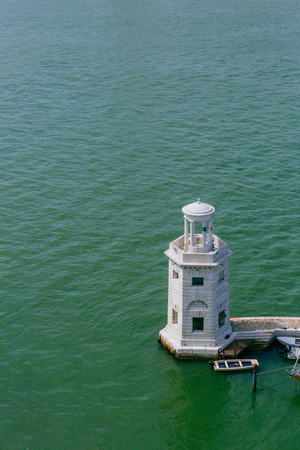 View of lighthouse and boats near the island of San Giorgio Maggiore, in Venice, Italyのeditorial素材