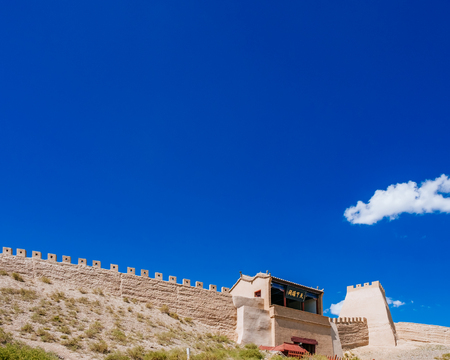Gate tower building under blue sky at Jiayu Pass, the first frontier fortress of Ming dynasty great wall, with plaque saying "Great Gate Tower under Heaven", in Jiayuguan, Chinaのeditorial素材