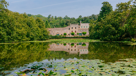 Castello del Catajo, a Venetian patrician house, and its reflectiton in the pond in the garden, near Padua, Italyのeditorial素材
